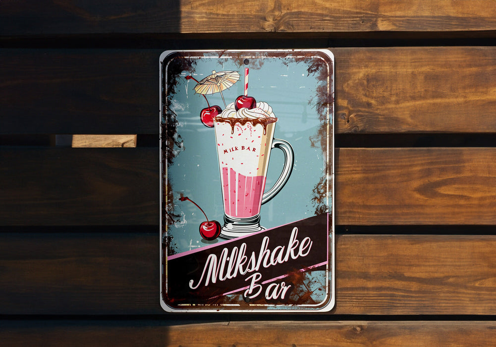 a metal sign on a wooden wall advertising milkshake bar