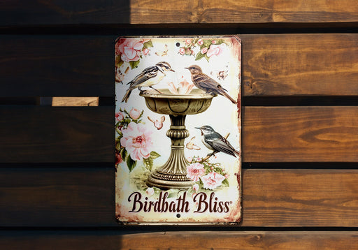 a birdbath bliss sign hanging on a wooden wall