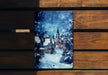 a wooden bench with a picture of a town on it