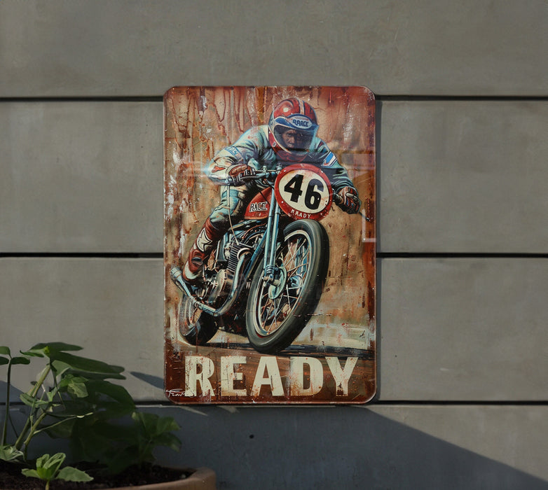 a painting of a man riding a motorcycle on a rusty sign