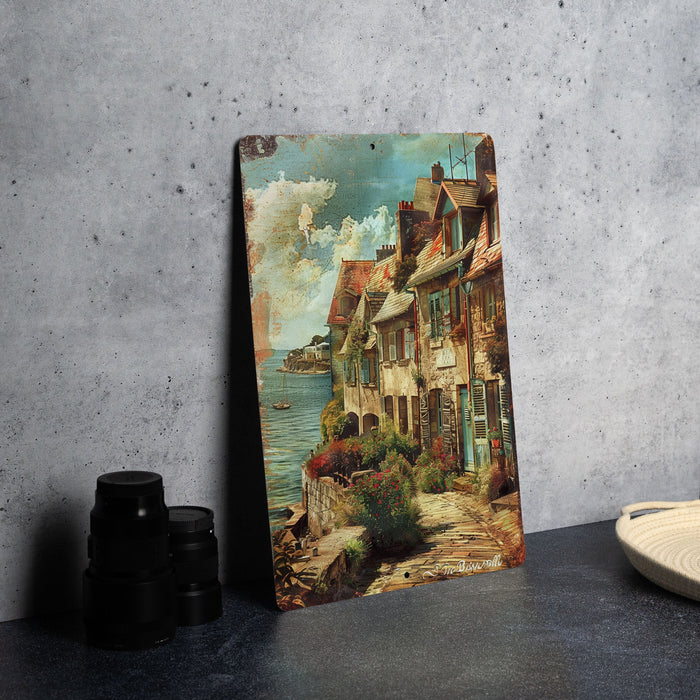 a painting on a table next to a pair of binoculars