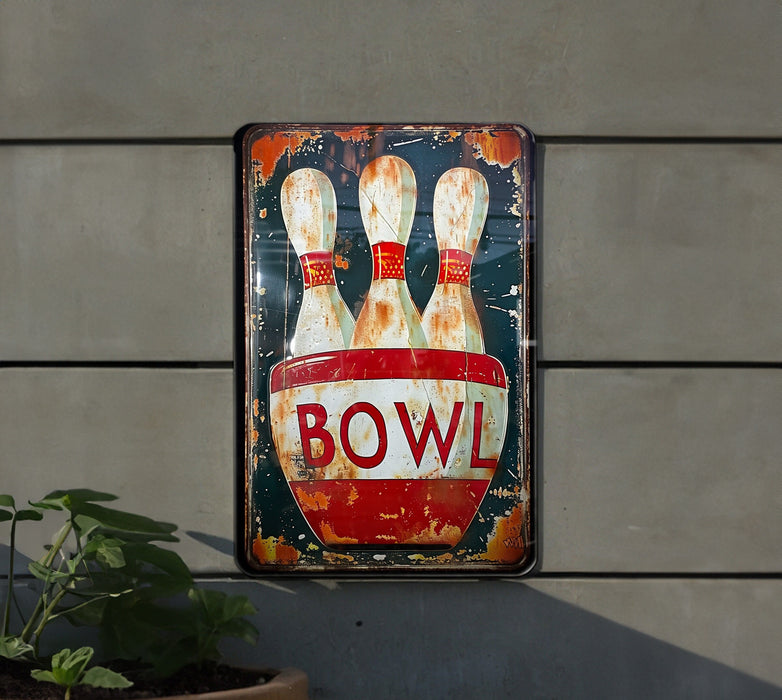 a bowling sign hanging on the side of a building
