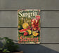 a sign on the side of a building advertising sangria