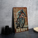 a painting of a motorcyclist on a rusty sign