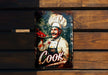 a metal sign with a picture of a cook on it