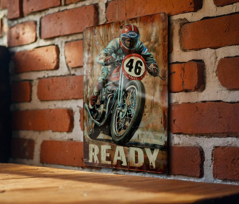 a painting of a man riding a motorcycle on a brick wall