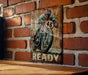 a painting of a man riding a motorcycle on a brick wall