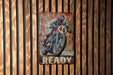 a painting of a man riding a motorcycle on a wooden wall
