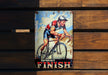 a tin can with a picture of a man riding a bike