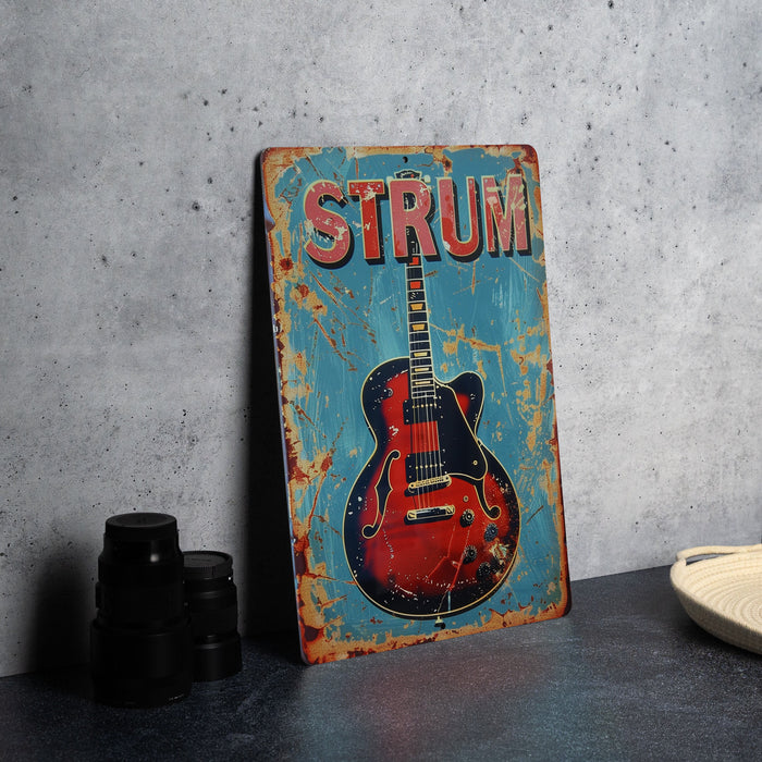 a sign with a guitar on it sitting on a table