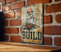 a sign on a brick wall that says build