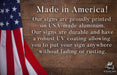 a wooden sign with an american flag on it