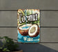 a sign that says coconut water on the side of a building