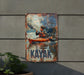a metal sign with a man in a kayak