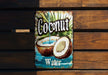 a close up of a sign on a wooden wall
