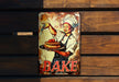 a tin sign with a woman holding a cake on it