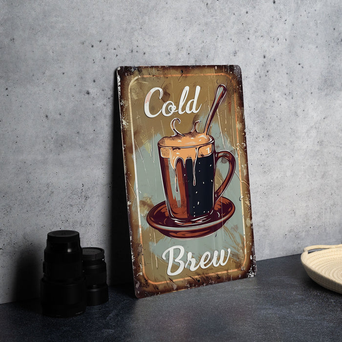 a metal sign that says cold and brew