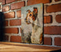 a picture of a dog hanging on a brick wall