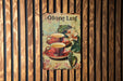 a painting of two cups of coffee on a wooden wall