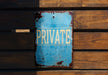 a blue sign that says private on it