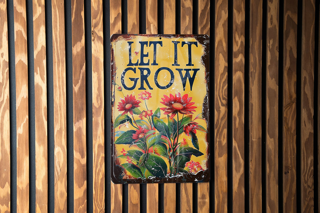 a sign on a wooden wall that says let it grow