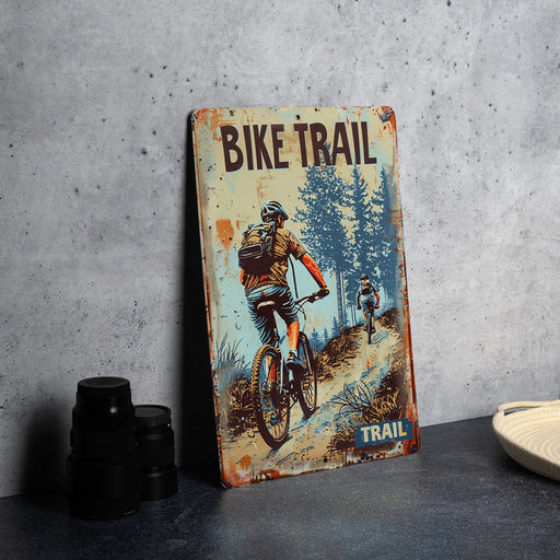 a bicycle trail sign sitting on top of a table