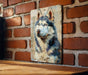 a painting of a husky on a brick wall