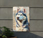 a painting of a husky dog on a wall