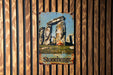 a picture of stonehenge on a wooden wall