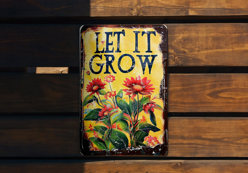 a sign that says let it grow on a wooden wall