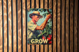 a poster of a man in a straw hat is hanging on a wooden wall