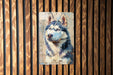 a painting of a dog on a wooden wall