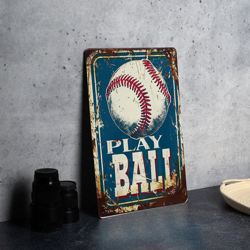 a metal sign with a baseball on it