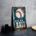 a metal sign with a baseball on it