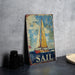 a sail sign sitting on top of a table