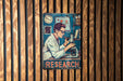 a poster of a man holding a microscope