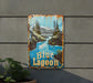 a blue lagoon sign hanging from the side of a building