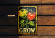 a sign on a wooden wall that says grow