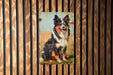 a painting of a dog on a wooden wall