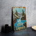 a blue lagoon sign sitting on top of a table