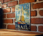 a picture of a sail boat on a brick wall