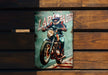 a painting of a man riding a motorcycle