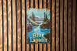 a blue lagoon sign hanging on a wooden wall
