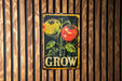 a sign on a wooden wall that says grow
