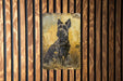 a painting of a dog on a wooden wall