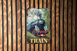 a train poster hanging on a wooden wall