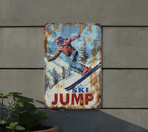 a ski jump sign hanging on the side of a building