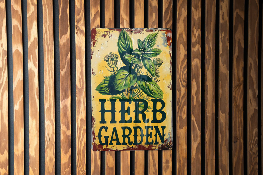 a sign on the side of a building that says herb garden