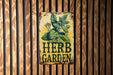 a sign on the side of a building that says herb garden
