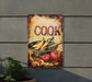 a sign on the side of a building that says cook